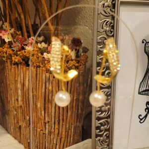 GOLD CRYSTAL POST EARRINGS WITH PEARL DROP BACKINGS.